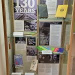 display case of Penn State writers and their books, with text about their lives and accomplishments.
