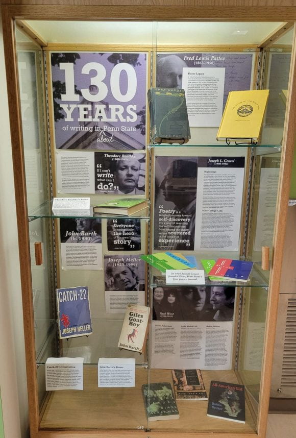 display case of Penn State writers and their books, with text about their lives and accomplishments.